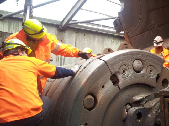 Engineers inspecting cracked drum