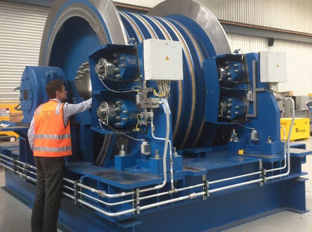 Man inspecting large machinery for safety
