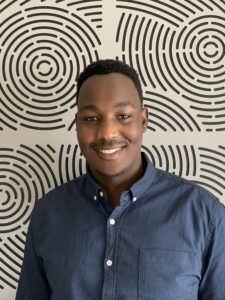 Photo of Brian in front of patterned background