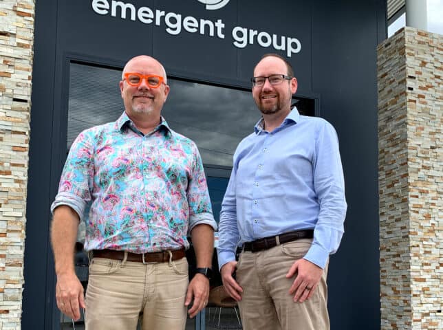 Chris Kellett and Paul Reynolds in front of entrance to Emergent Group HQ
