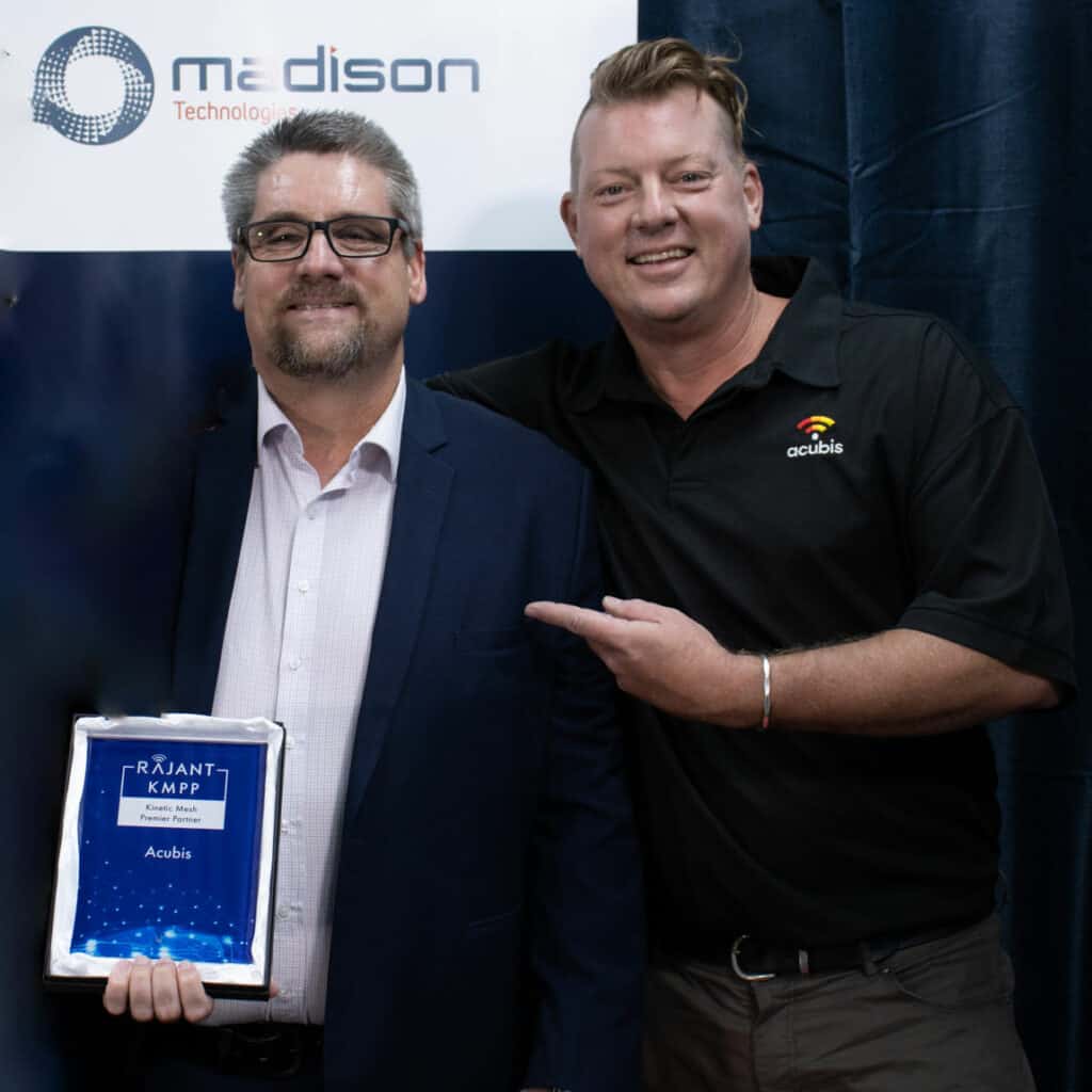 Jeff Berg with Madison rep accept Rajant accolade