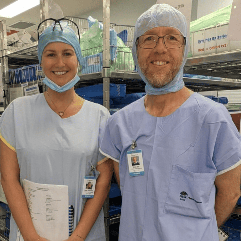 Sarah and Simon dressed in hospital scrubs