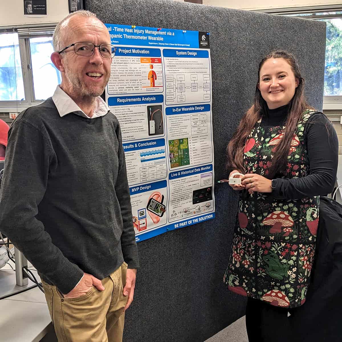 Simon Bull and Mikyla Peters in front of Mikyla's project poster